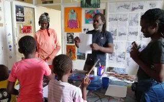Mukabi teaching some basics during one of his art classes at his Studio in Nairobi