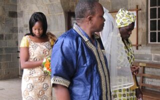 My late uncle Arthur Kinuthia Thindiu on my wedding day holding my hand down the aisle with my mum
